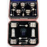 An Edward VII silver five piece condiment set, comprising - four two handled urn pattern salts