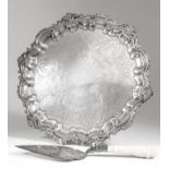 A late Victorian silver circular tray with moulded pie crust rim and with bold C and S scroll and