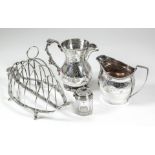 A late Victorian silver oval boat pattern six division toast rack, with wire work divisions and