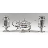 A pair of George V silver cylindrical condiment pots of "George III" design, each with slightly