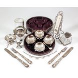 A set of four Victorian silver circular salts, with moulded rims and on three leaf capped scroll