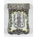 A late 19th / early 20th Century French silvery metal and enamel vesta case of shield shape with