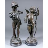 A modern bronzed white metal figure of Cupid with bow and garland, on turned ebonised base, 15.75ins