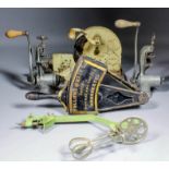 A collection of kitchen equipment, including - Grinders, choppers, slicers, and mincers, various