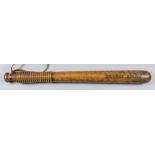 A late Victorian turned ash truncheon, stamped "Dundee Police", with ribbed handle and leather