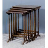 A nest of four 20th Century mahogany rectangular occasional tables of "Georgian" design, on