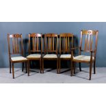 A set of five early 20th Century walnut high back dining chairs of "Arts and Crafts" design (