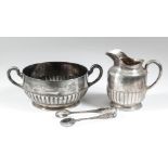 A Victorian silver circular two-handled sugar bowl with part reeded body on circular footrim, 3ins