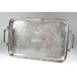 A Victorian silver rectangular two-handled tray with reeded mounts and moulded scroll handles, the