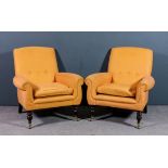 A pair of modern square back easy chairs with out-scrolled arms, upholstered in orange weave cloth