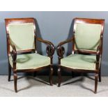 A pair of 19th Century French mahogany open armchairs of "Empire" design, the square backs and seats