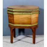 A George III mahogany and brass bound octagonal wine cooler, with original lead foil lining to