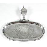 A Queen Anne silver oval snuffer tray, the centre engraved with a bold oval armorial and bold leaf