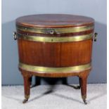 A George III mahogany and brass bound oval wine cooler, now with galvanised lined interior, three