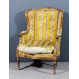 A French gilt framed fauteuil of Louis XV design, the moulded show wood frame with rope carving,