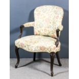 A George III mahogany open armchair of "French Hepplewhite" design, the shaped back, seat and