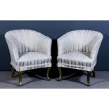 A pair of early 20th Century tub shaped easy chairs upholstered in striped floral pattern cloth,