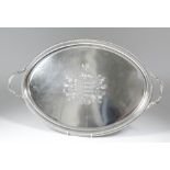 A good George III silver oval two-handled tray with bold gadroon mounts to rim and handles, the
