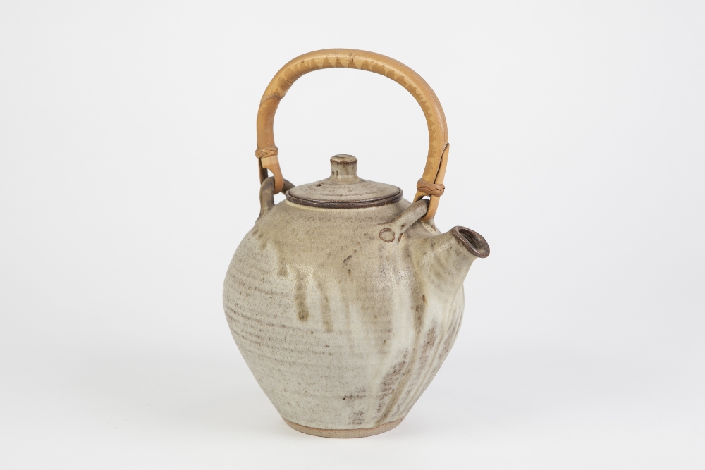 ANCHOR POTTERY, ST. IVES, TEAPOT, of ovoid form with bamboo handle, glazed in matt tones of grey and