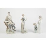 THREE LLADRO PORCELAIN FIGURES, one modelled as a young shepherd, another of two children at prayer,