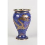 WEDGWOOD 'DRAGON' LUSTRE CHINA VASE, of footed ovoid form with lipped rim, the exterior gilt printed