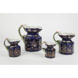 SET OF FOUR CIRCA 1830 STAFFORDSHIRE POTTERY OCTAGONAL JUGS, with 'dragon' handles, the royal blue