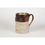 NINETEENTH CENTURY SALT GLAZED STONEWARE MOULDED QUART MUG, of cylindrical form with strap handle,