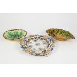 FRENCH FAIENCE PLAQUE, the centre with radiating flutes and painted floral decoration, robust
