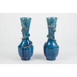 PAIR EARLY 20TH CENTURY CHINESE BLUE GLAZED EARTHENWARE VASES the ovoid shouldered body with tall