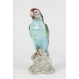 ANTIQUE CONTINENTAL PORCELAIN MODEL OF A PARROT, standing on a rock, 9 3/4" (24.8cm) high (a.f.) and