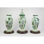 A GARNITURE OF THREE PALE GREEN OPALINE GLASS VASES one with cover, each enamelled and gilt with a