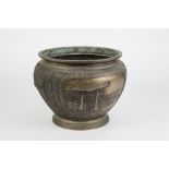 A JAPANESE MEIJI PERIOD PATINATED COPPER ALLOY JARDINIERE CAST WITH OPPOSING LANDSCAPE PANELS within