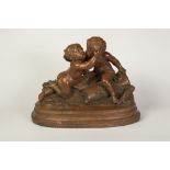 NINETEENTH CENTURY FRENCH TERRACOTTA GROUP, Signed Cholin, modelled as two putti embracing, raised