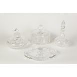 FOUR PIECES OF WATERFORD CUT GLASS, COMPRISING; TWO CIRCULAR DRESSING TABLE JARS and covers, one