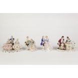 FOUR TWENTIETH CENTURY DRESDEN LACE PORCELAIN FIGURES, comprising: two groups of musicians and two