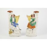 PAIR OF NINETEENTH CENTURY STAFFORDSHIRE FLAT BACK SPILL VASE FIGURES, each heightened in colours