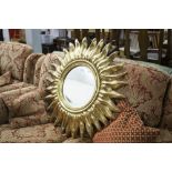 A GILT FRAMED CIRCULAR SUNBURST WALL MIRROR