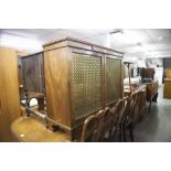 A VICTORIAN MAHOGANY CUPBOARD (ADAPTED AS A RADIATOR COVER), TWO DOORS WITH CRISS-CROSS BRASS DETAIL