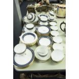 TUSCAN CHINA TEA AND DESSERT SERVICE WITH BLUE AND GILT BORDERS FOR 12 PERSONS, 68 PIECES (SOME A.