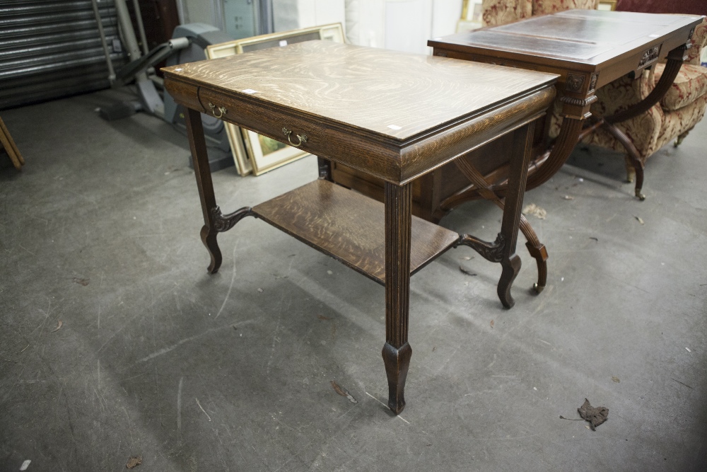 AN OAK OBLONG SIDE TABLE, WITH SINGLE DRAWER, RAISED ON FOUR LEGS WITH UNDERTIER