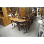 A WALNUTWOOD QUEEN ANNE STYLE DINING ROOM TABLE AND SIX SINGLE CHAIRS