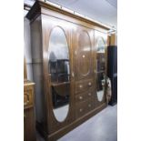 LATE NINETEENTH CENTURY INLAID OAK BEACONSFIELD TYPE WARDROBE WITH TWO OVAL MIRROR PANEL DOORS (A.