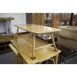 AN ERCOL LIGHT ELM OBLONG COFFEE TABLE WITH UNDERSLUNG MAGAZINE RACK