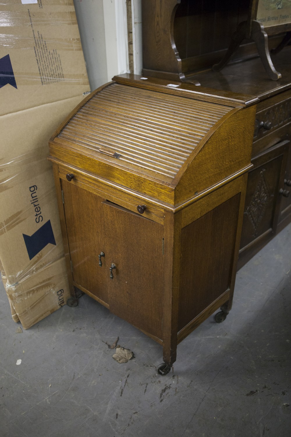 SMALL OAK CABINET WITH TAMBOUR TOP