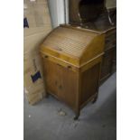 SMALL OAK CABINET WITH TAMBOUR TOP
