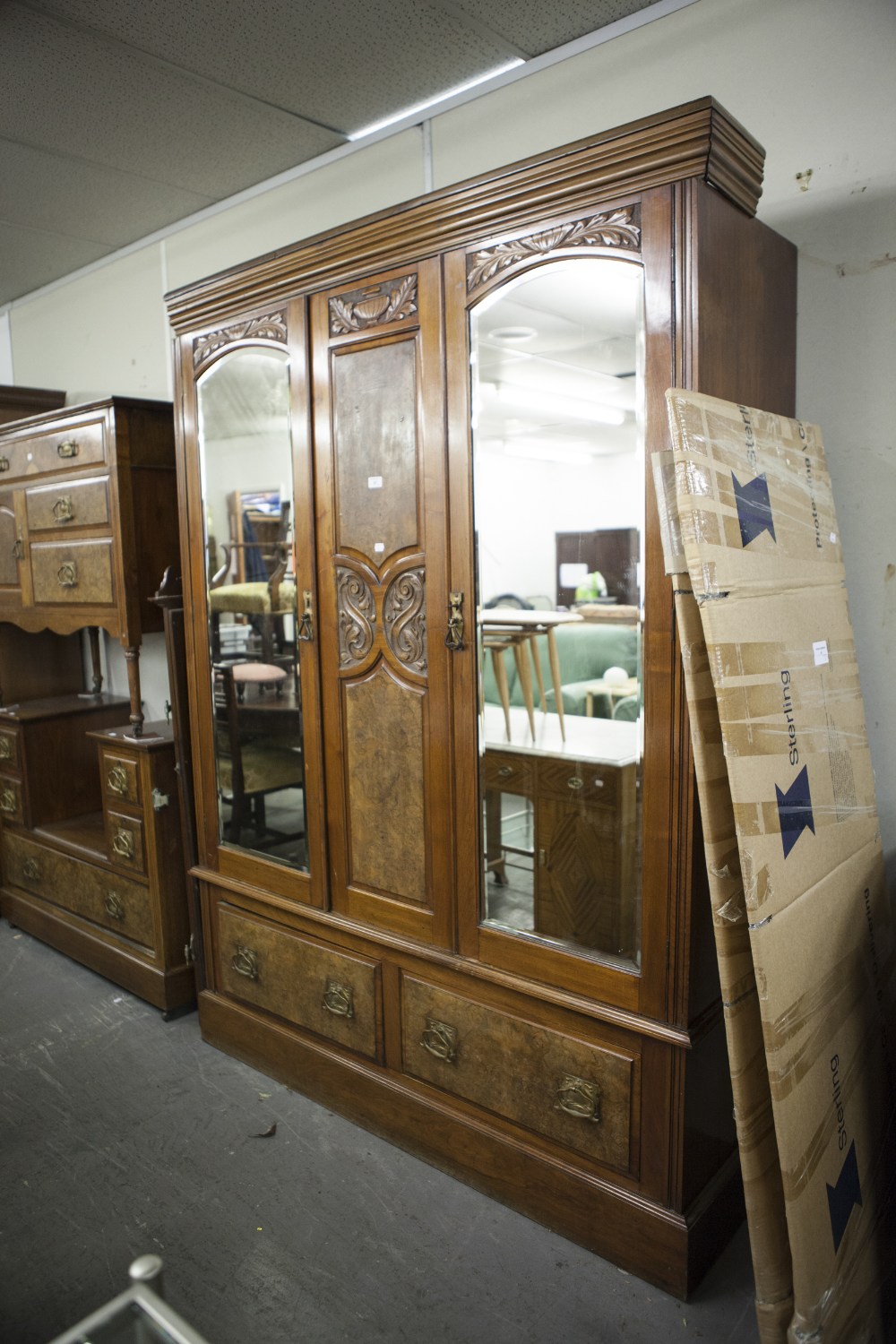 A VICTORIAN BEDROOM SUITE OF THREE PIECES VIZ, A TRIPLE WARDROBE WITH MIRRORS TO EACH DOOR, TWO