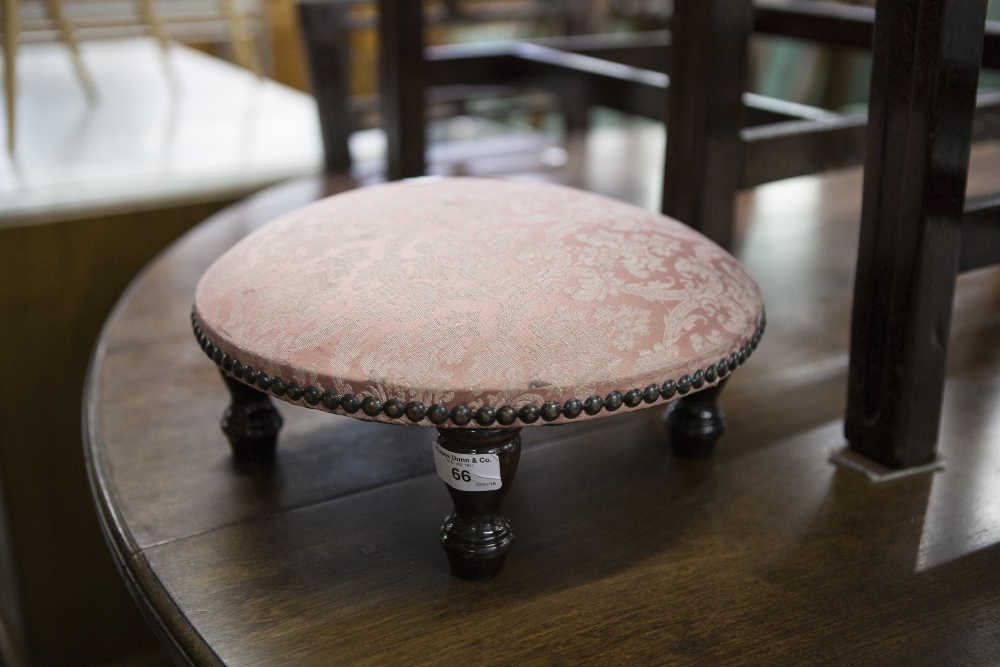 A TAMBOURET STOOL OF PAD TOP, STUD DETAILS, ON FOUR SUPPORTS