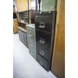 A GREY METAL THREE DRAWER FILING CABINET AND A FOUR DRAWER DITTO (2)