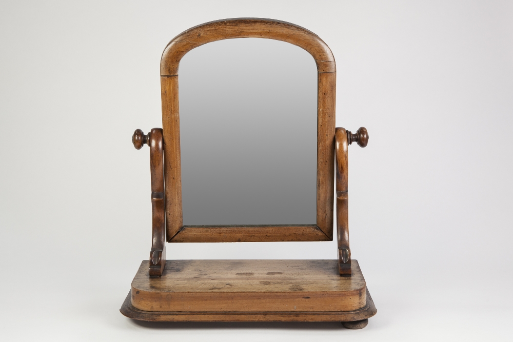 VICTORIAN MAHOGANY TOILET MIRROR, with milestone plate and moulded rounded oblong base (a/f)