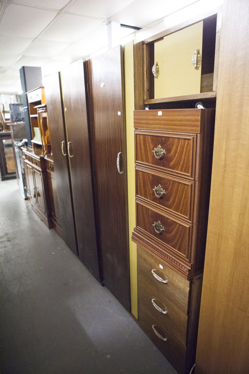 A BEDSIDE CHEST OF THREE DRAWERS AND TWO MATCHING SMALL WARDROBES